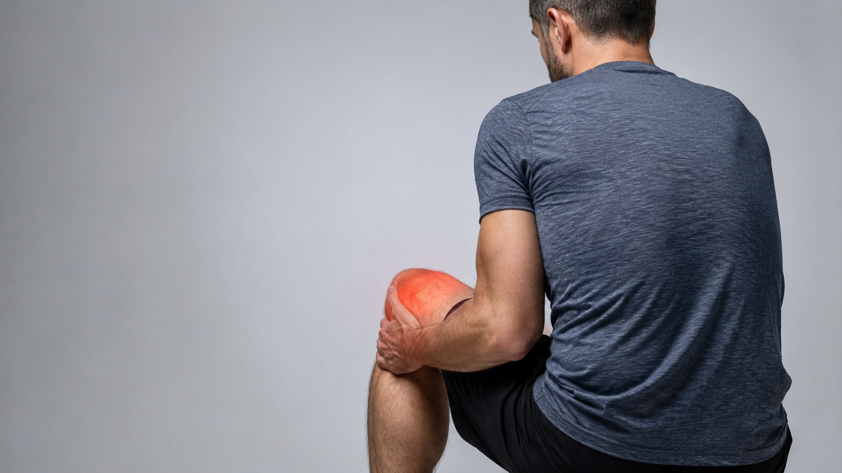 Person experiencing knee pain during movement